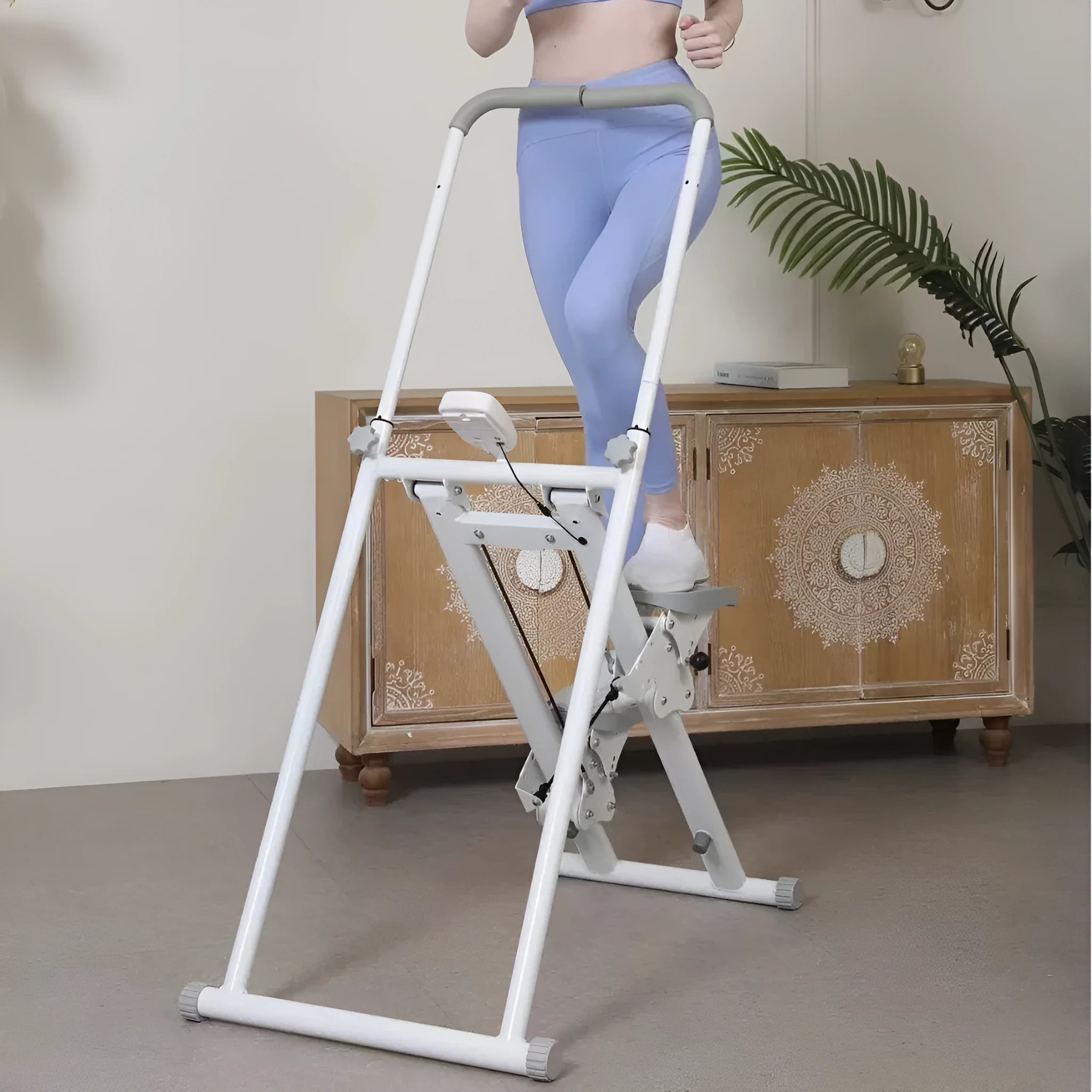White folding treadmill with integrated climbing bars for home fitness