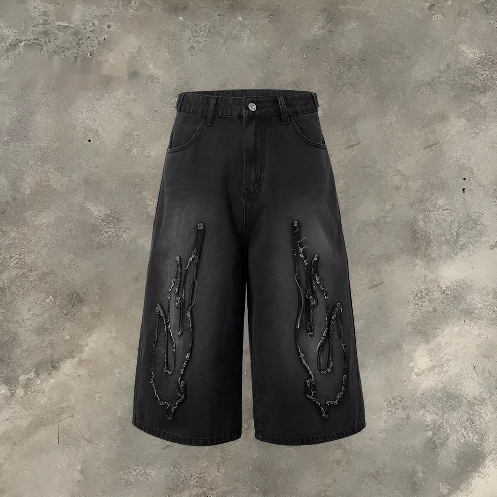Men's black denim shorts with flame embroidery patch on straight leg cropped design