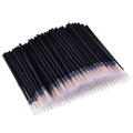 Pack of one hundred black disposable eyeliner brushes with fine point tips and plastic sleeves.