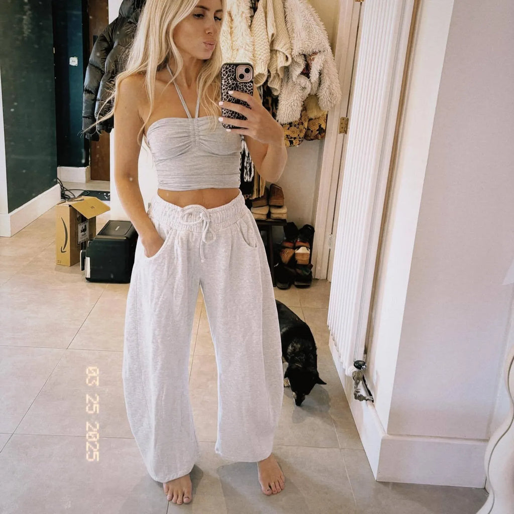 Loose cropped cotton sweatpants with drawstring waist and side pockets in street fashion style