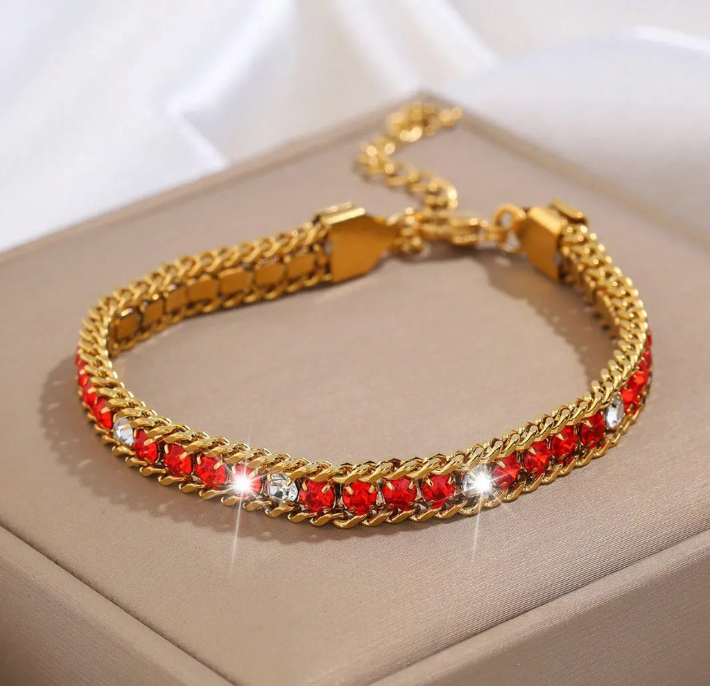 Three-layer gold electroplated stainless steel chain bracelet on women's wrist with geometric links