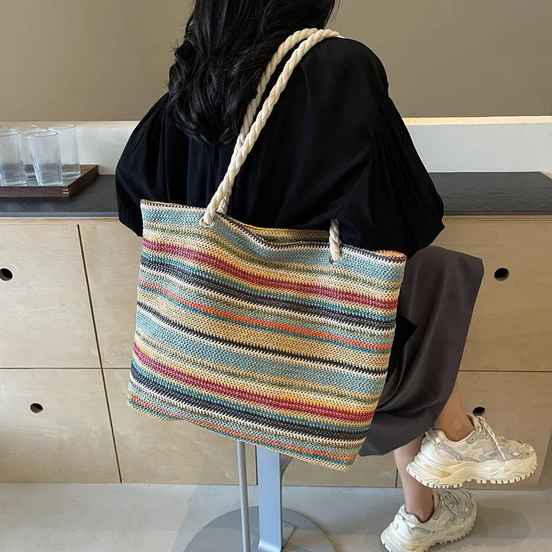 Blue straw woven nylon shoulder bag with polyester lining and single shoulder strap