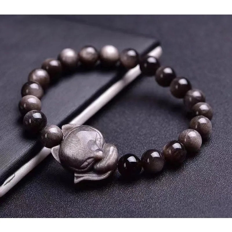 Obsidian fox charm bracelet for women showing a single black polished 8mm stone carved into a fox design.