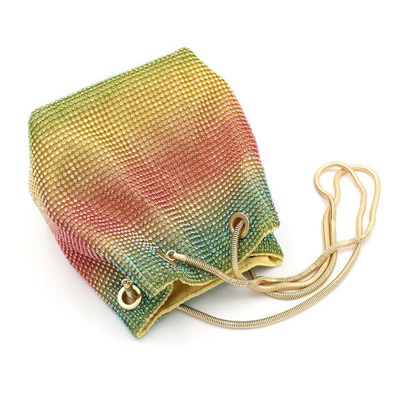 Colourful rhinestone bucket bag with glitter finish and soft fabric construction
