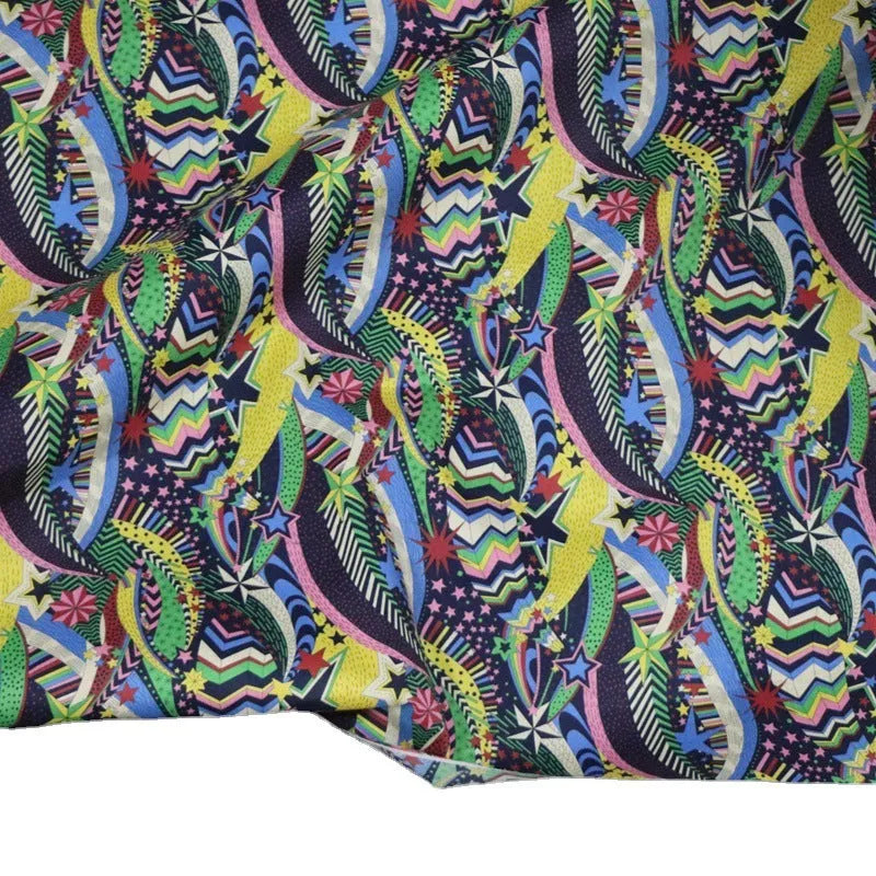 Blue cotton fabric with digitally printed plant and flower design showing 145cm width