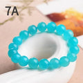 Natural amazonite scattered beads in ice colour grades for jewellery making, showing polished surfaces and size variations
