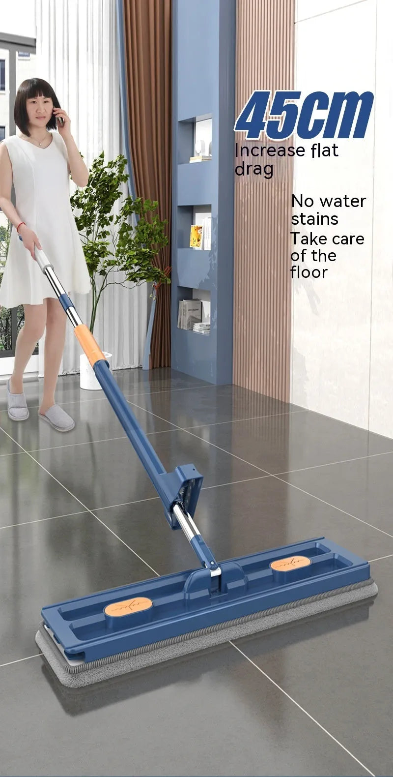 Large blue flat mop with long stainless steel handle and rotating head shown on hard floor