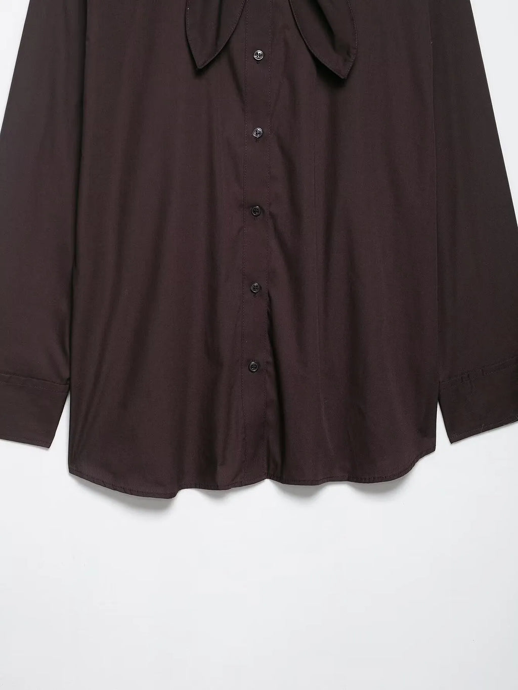 Brown women's loose-fit poplin shirt with long sleeves and a built-in bow tie detail.