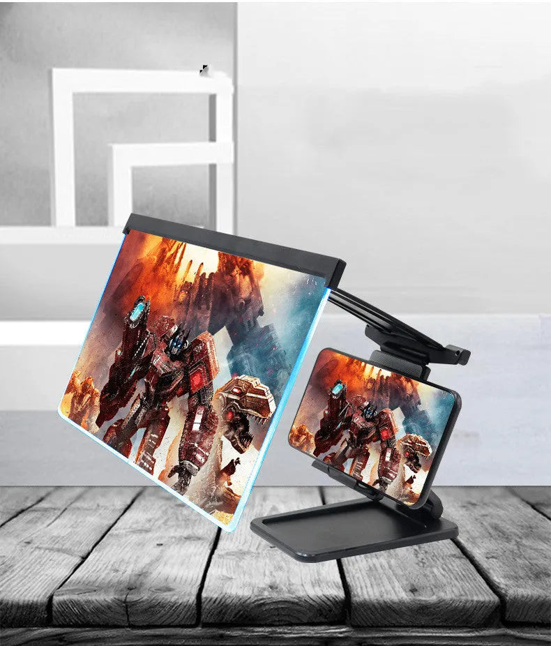 Black folding mobile phone screen amplifier with detachable holder on desktop