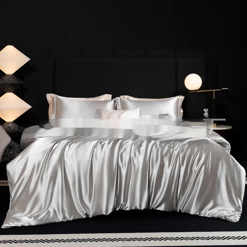 Silk four-piece bedding set in a solid colour, shown in one of seven shades including Ash Purple or Matcha Green.