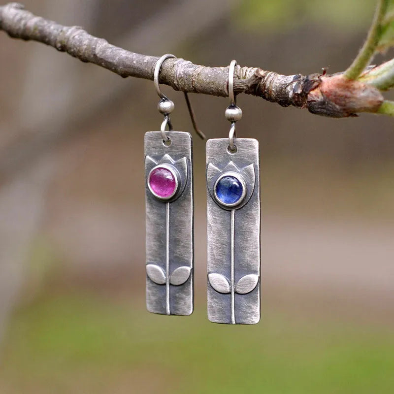 Antique finish red sapphire geometric earrings with elliptical stones and retro styling