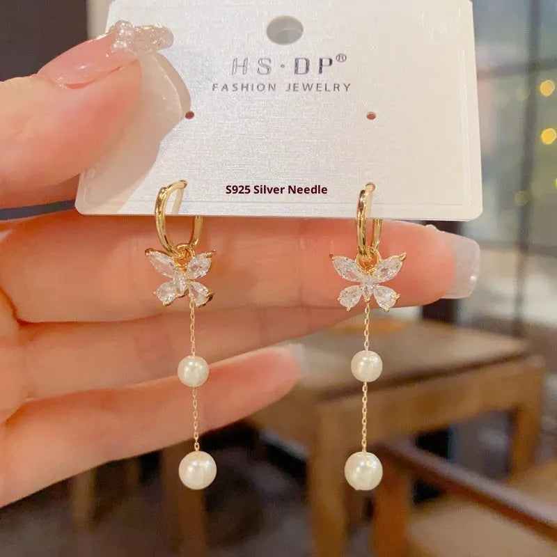 One pair of gold plated copper ear clips with butterfly pearl tassel design, clip-on style for women