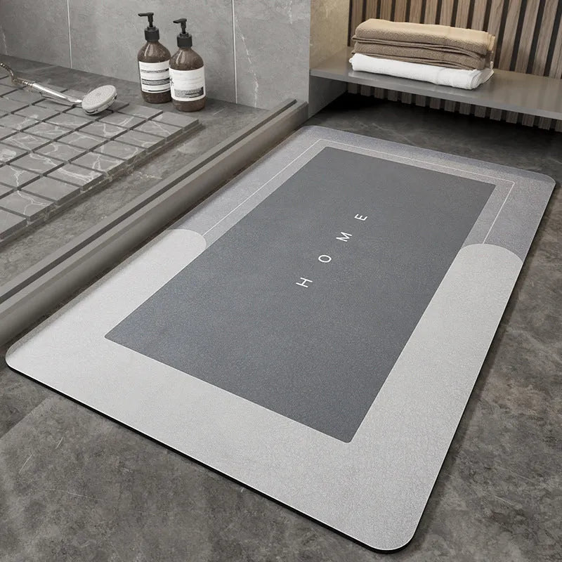 Blue oval blended bathroom floor mat on tiled floor next to a bath.
