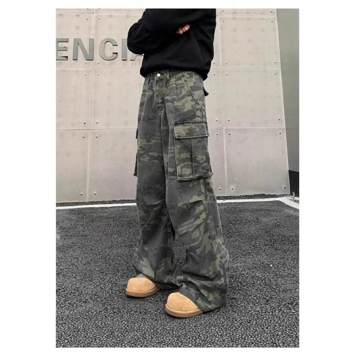 Cotton blend cargo pants in a washed camouflage print with multiple pockets and a mid waist.