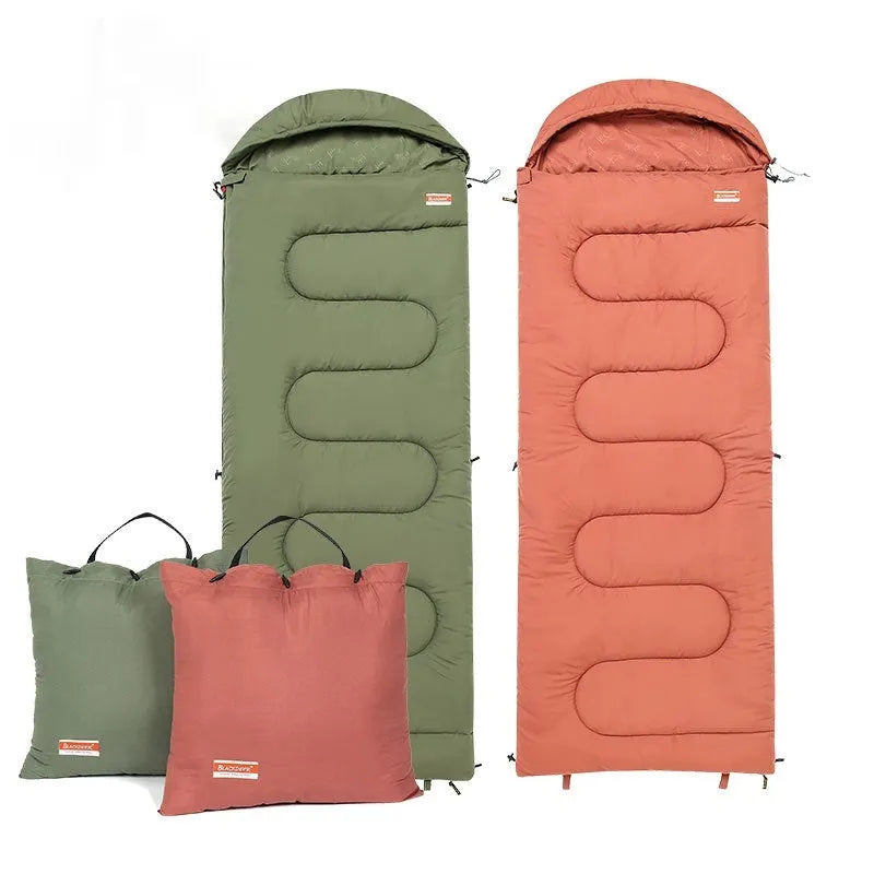 Ochre and olive green ultra-light cotton camping sleeping bag quilt rolled up.