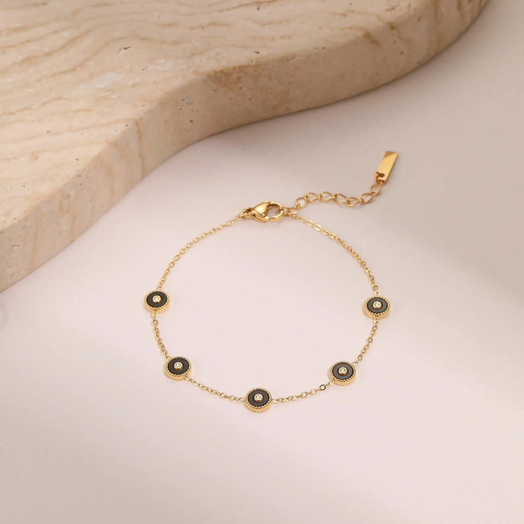Women's stainless steel bracelet with 18K gold plating and geometric fritillary pattern design
