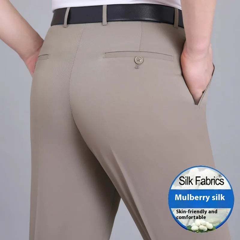 Man wearing dark blue non-iron straight-fit mulberry silk blend business trousers.