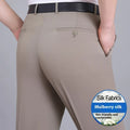 Man wearing dark blue non-iron straight-fit mulberry silk blend business trousers.