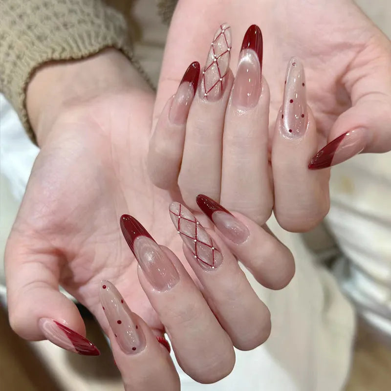 Pack of sweet girl style fake nails showing random colour designs in a set of ten.