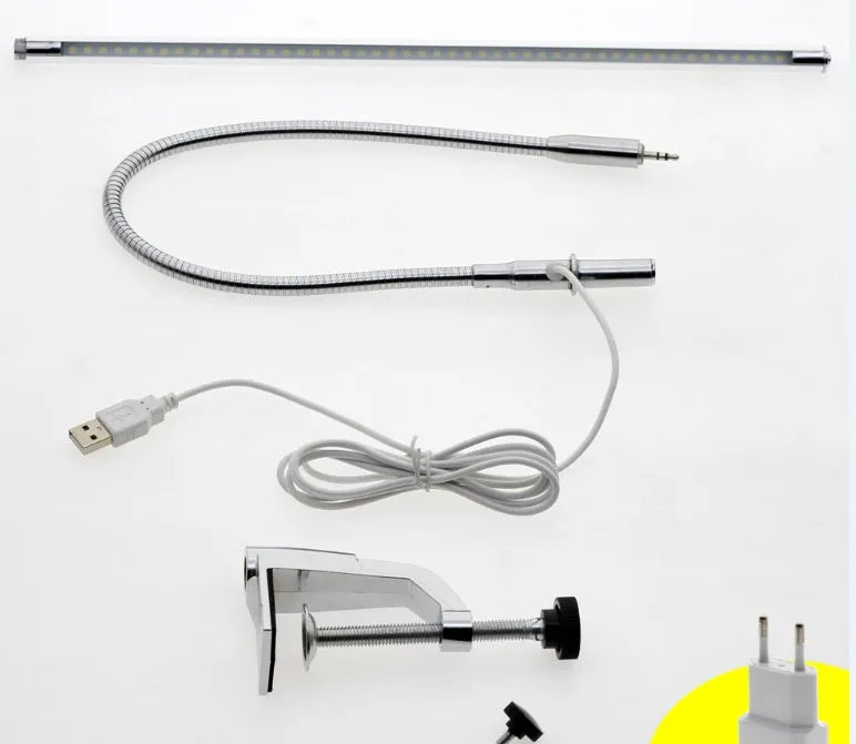 Silver aluminium LED nail lamp with long adjustable arm and clip mounting for workstation illumination