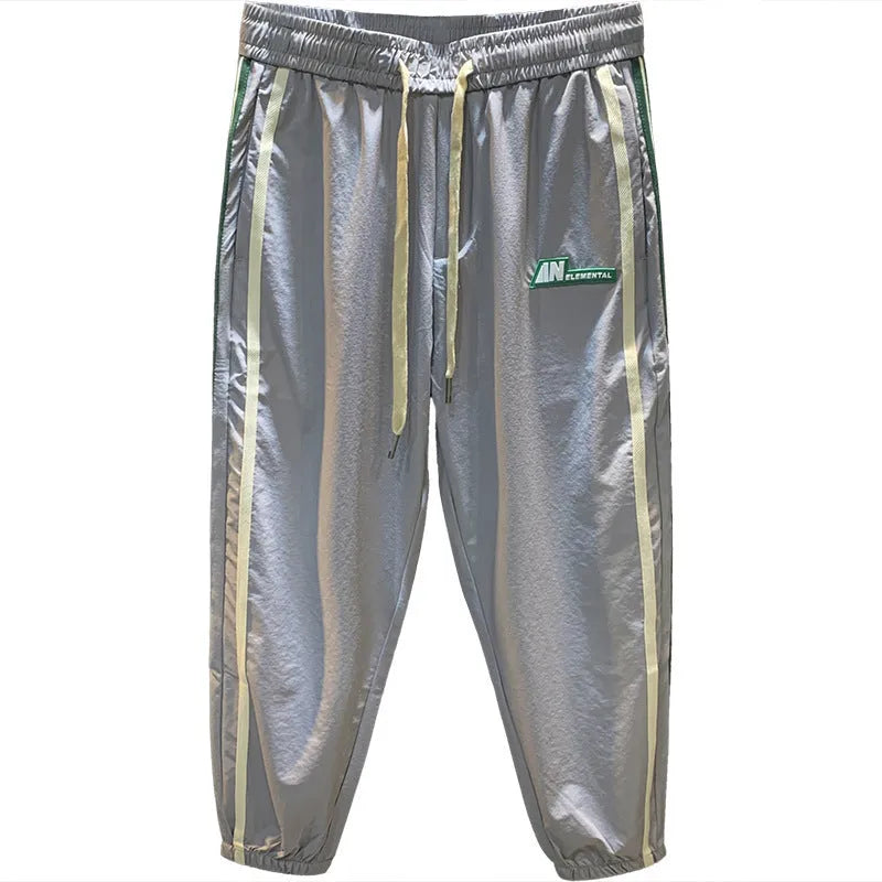 Men's black and grey ice silk harem pants showing dropped crotch design and mid waist fit