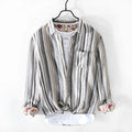 Men's gray striped linen shirt with long sleeves and loose fit on a hanger