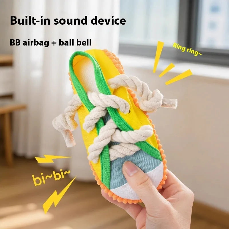 Squeaker dog chew toy shaped like slippers in plastic with bends for dental cleaning