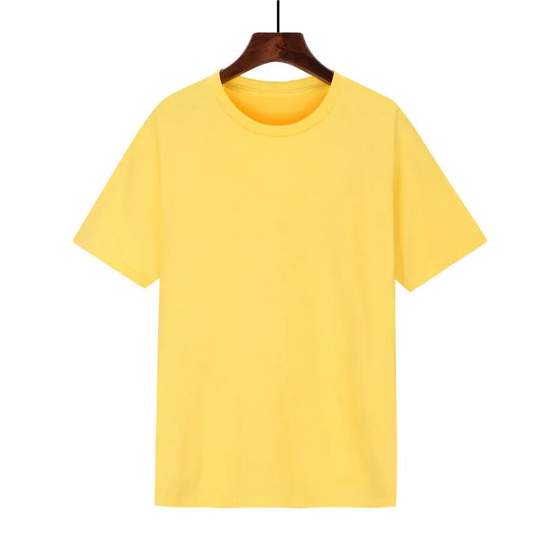 A man's loose-fitting black cotton t-shirt with short sleeves on a hanger.