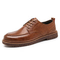 Men's black casual leather shoes with a round toe and flat rubber sole on a white background
