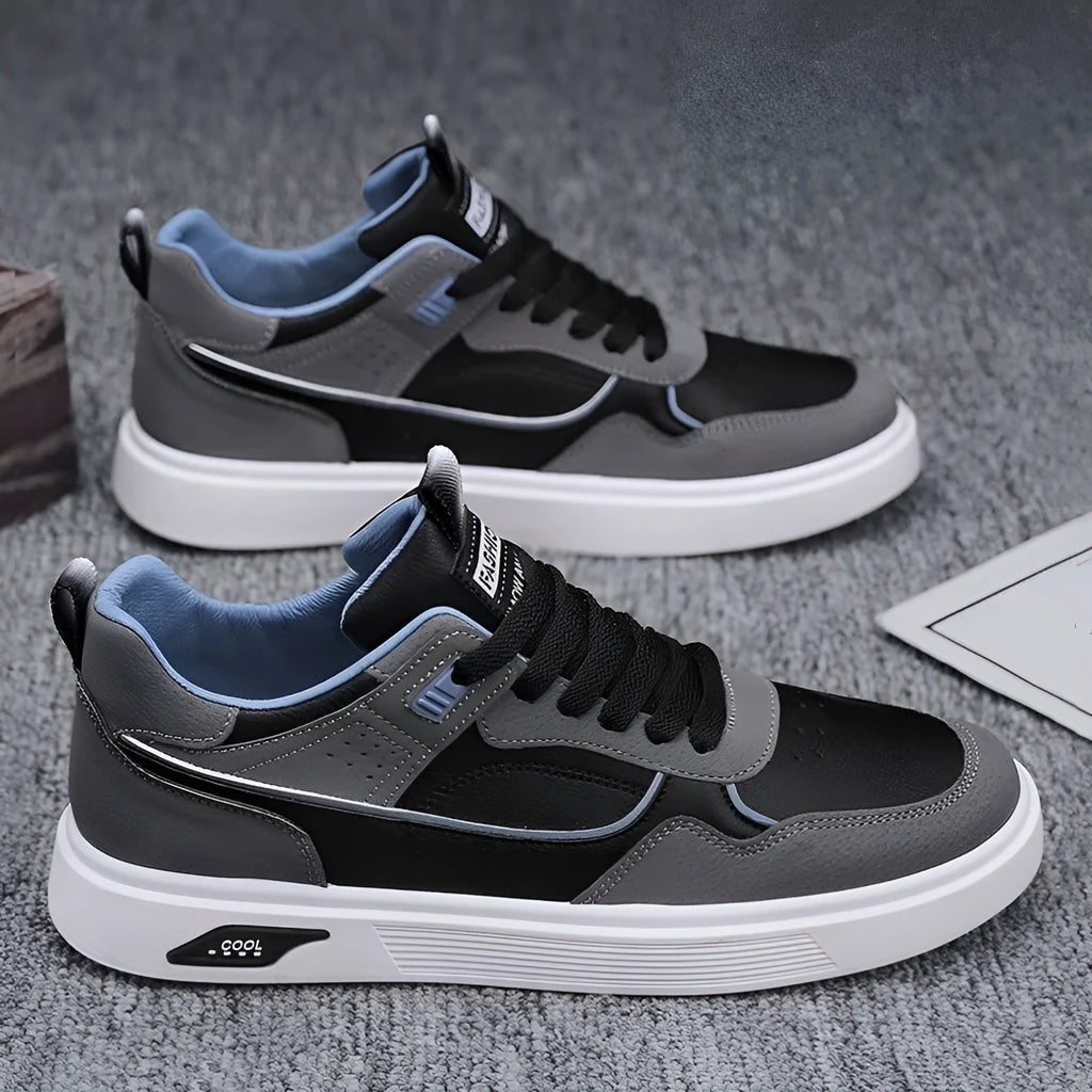 Men's low-top canvas board shoes in black with mesh lining and leather stitching details