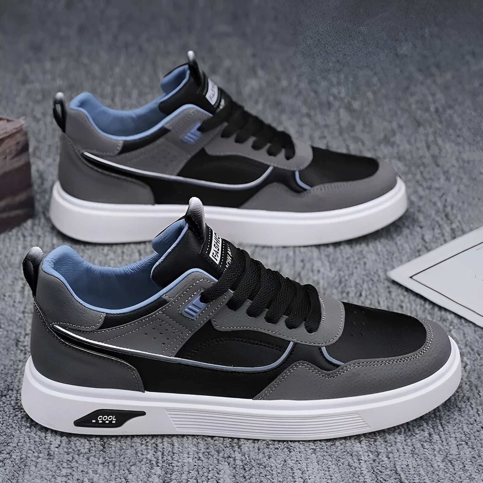 Men's low-top canvas board shoes in black with mesh lining and leather stitching details