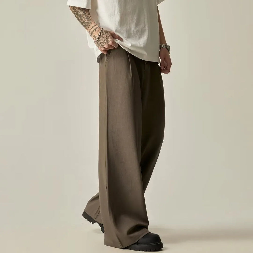 Men's black vertical tube wide-leg casual trousers showing straight-leg silhouette and mid waist design