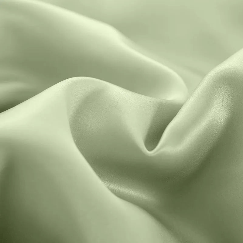 Double-sided solid colour silk duvet cover shown in multiple colour options.