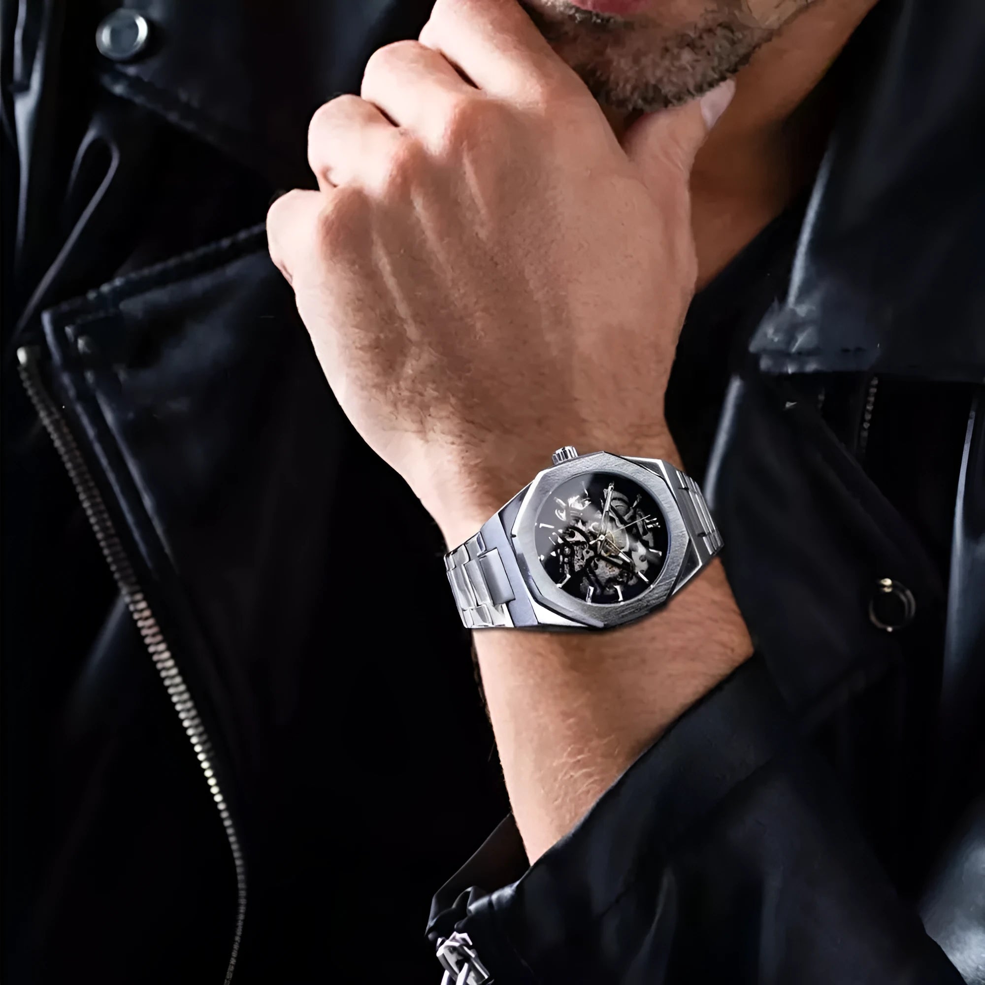 Men's mechanical automatic watch with skeleton dial, stainless steel case, and black genuine leather band on a white background