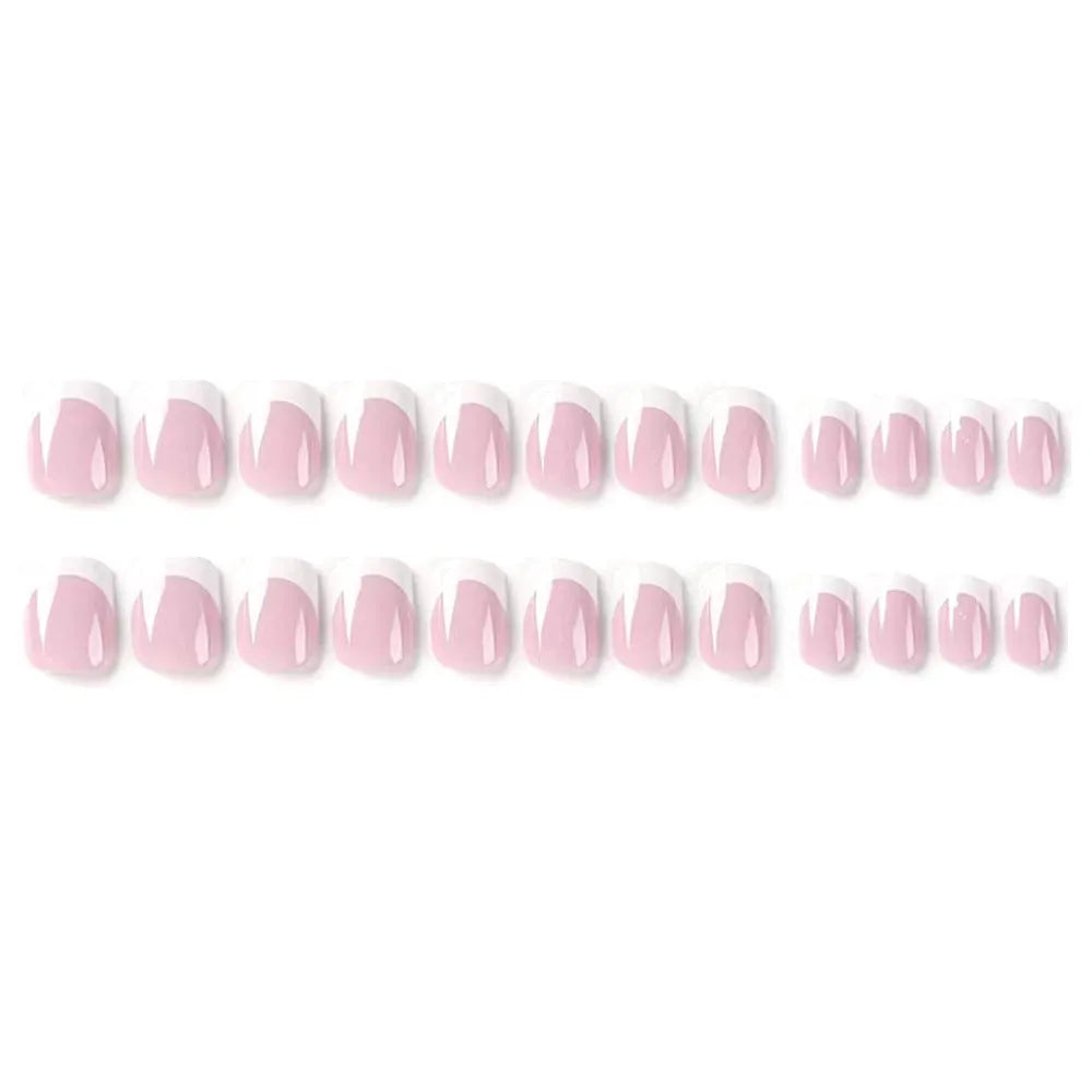 24 white square fake nails with a black and white plaid pattern arranged on a table.