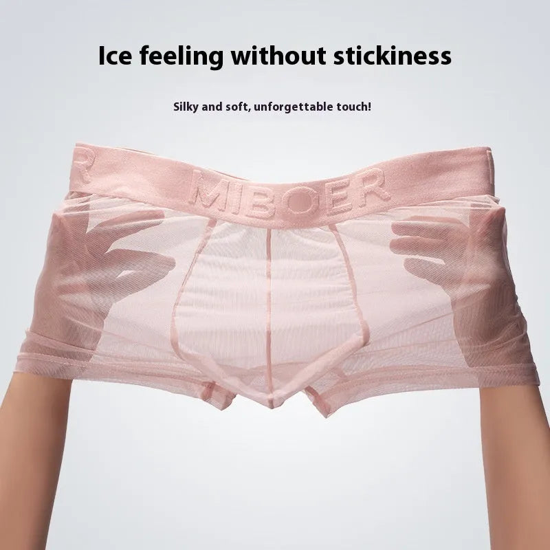 Men's thin solid colour boxer shorts in black, white, blue, green, pink, and skin colour on a white background.