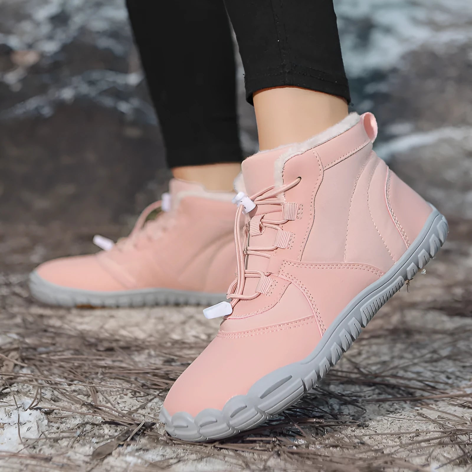 Waterproof fleece-lined outdoor snow boots with round toe and front lace-up in black, khaki, or pink.