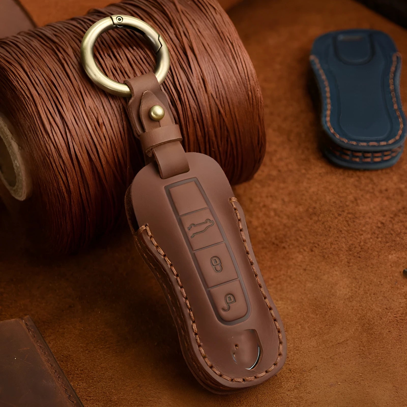 Genuine cowhide leather retro-style key cover for Porsche cars, shown in blue and brown colour options.