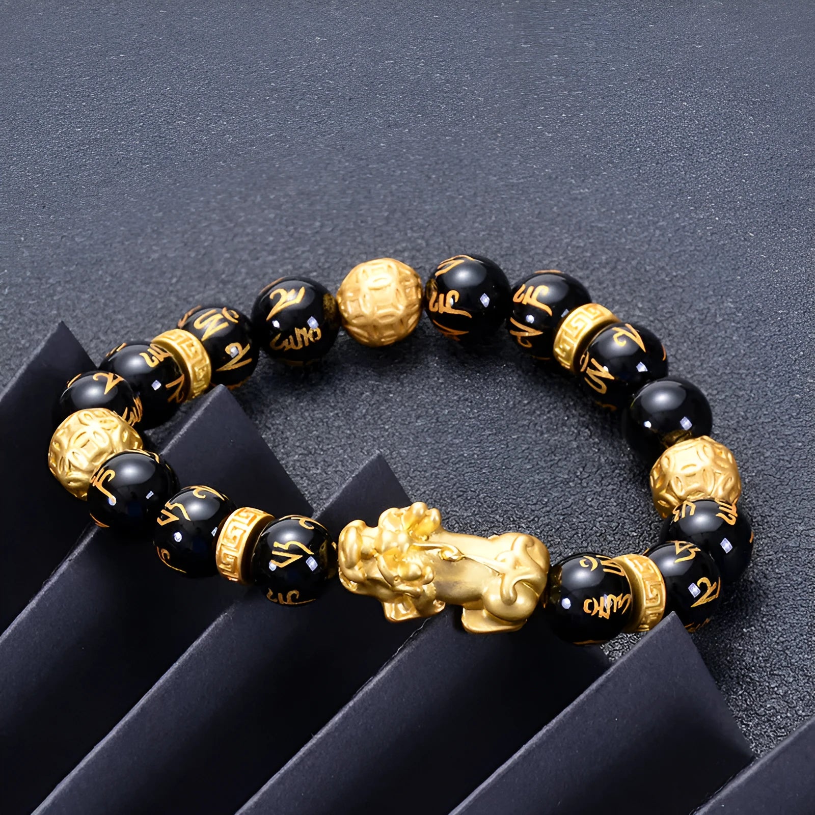 Unisex natural black agate stone bracelet with imitation gold accent, round bead design