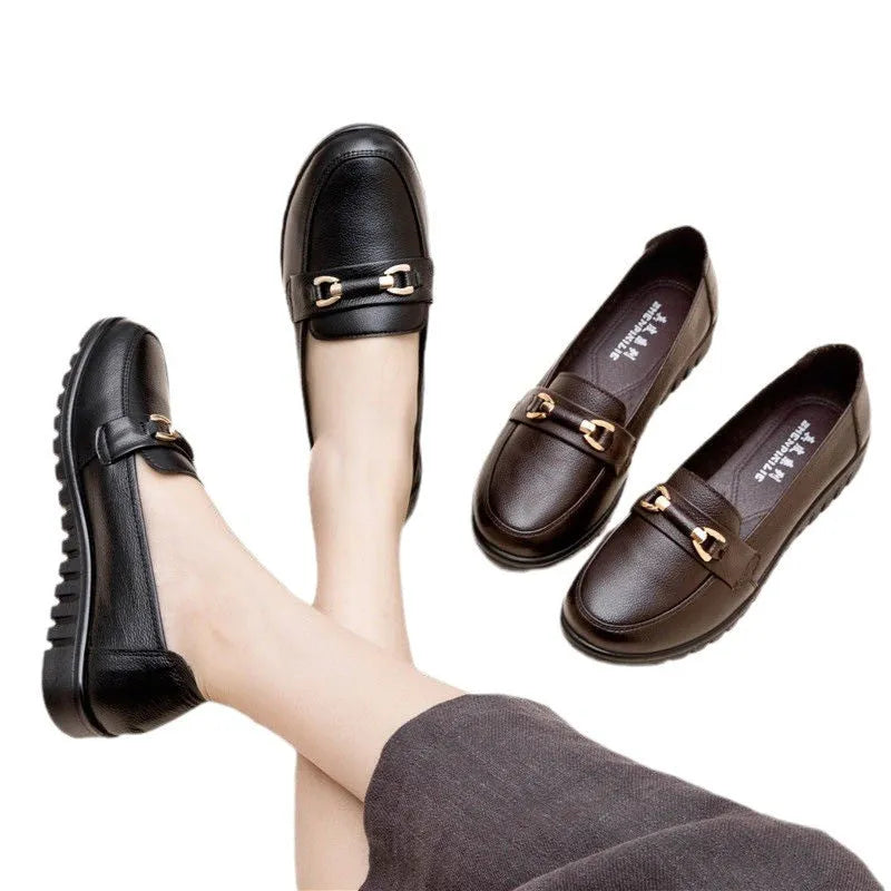 Black women's microfibre slip-on pumps with a round toe and low flat heel on a rubber sole.