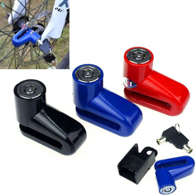 Black iron disc brake lock with red reminder rope attached, placed on a bicycle disc rotor for security