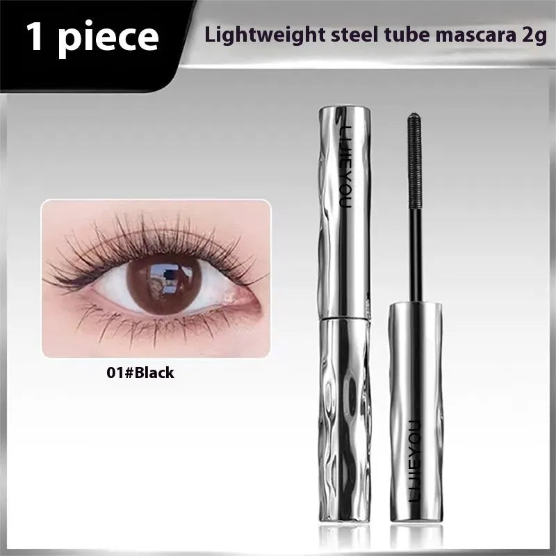 Waterproof black and brown mascara in a steel tube, shown with an optional eyelash curler.