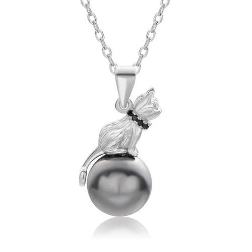Close-up of a sterling silver cat pendant necklace on a chain with an electroplated finish.