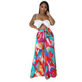 Women's high waist printed wide leg trousers in polyester fiber available in multiple colours