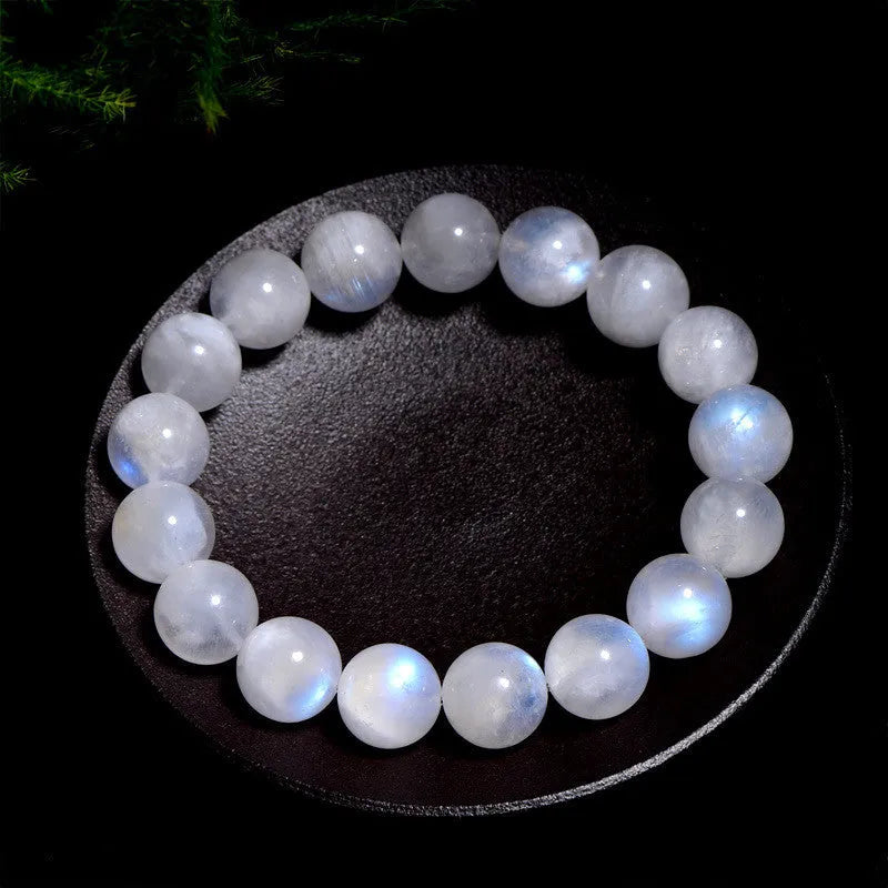 Natural blue moonlight round bead moonstone bracelet with geometric shape on a wrist.