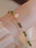Green olivine double layer bracelet with Bells of Ireland charms and olive branch detailing for women