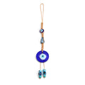 Glass evil eye bead ornament with Turkish blue eye pattern and braided string for wall or car hanging