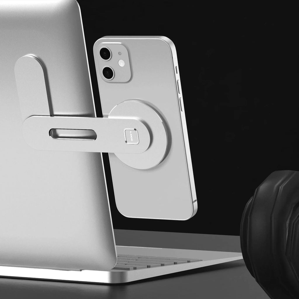 Aluminum alloy magnetic desktop expansion bracket for notebook computers, shown in silver finish.