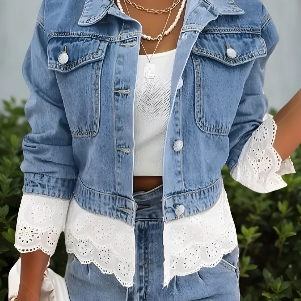 Blue women's denim jacket with white lace stitching details on the front, showing long sleeves.