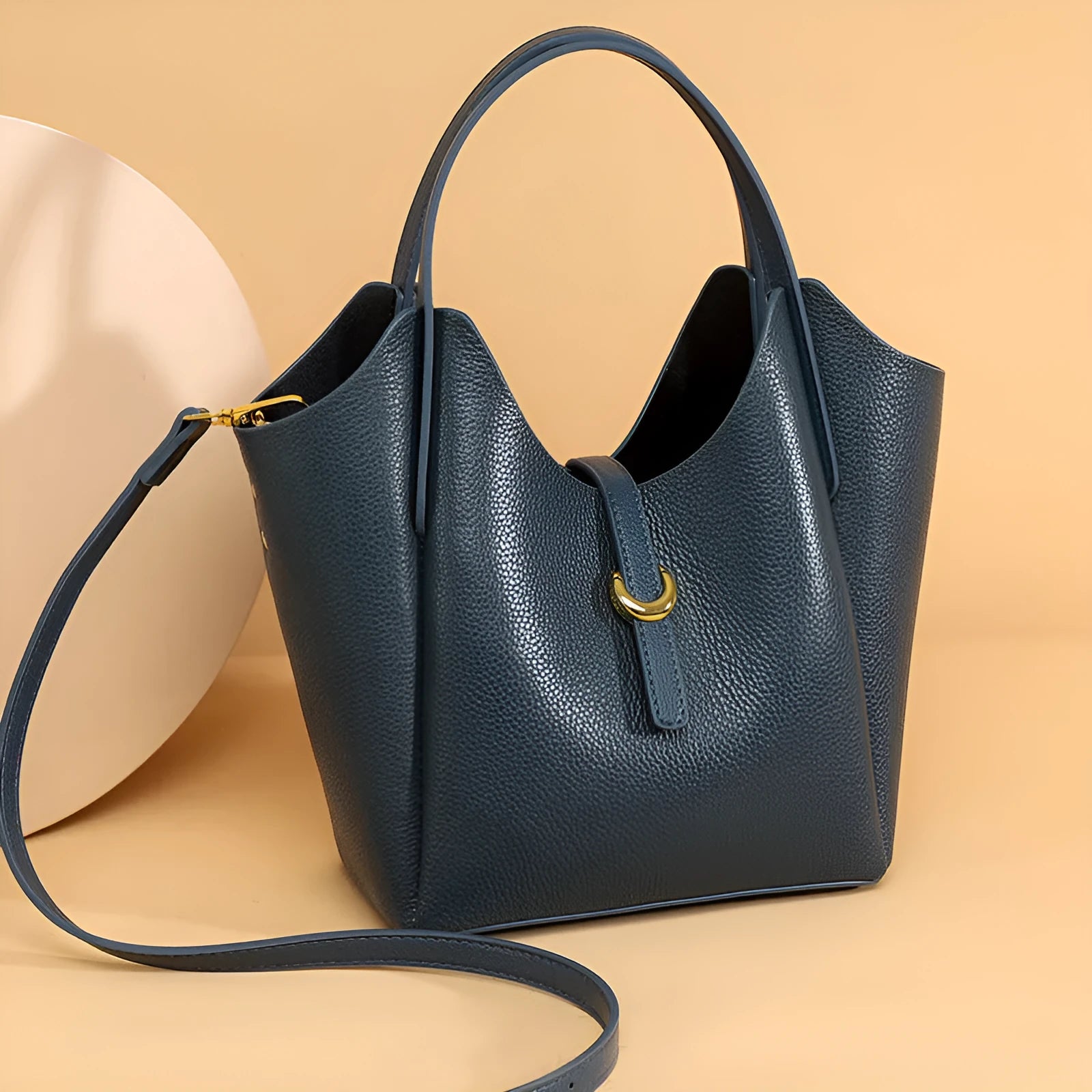 Genuine leather women's large capacity hand holding bucket bag in retro style.